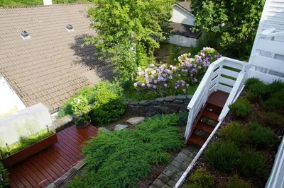 an overhead view of a garden with flowers and a ladder at Cozy room in a house with a garden on the island of Askøy, near Bergen in Askøy