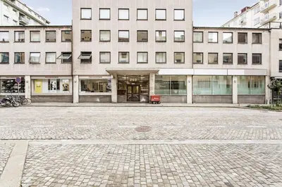 an empty parking lot in front of a building at Cozy Studio Retreat in Bergen