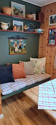 a couch sitting on the floor in a room at Vesletun in Balestrand