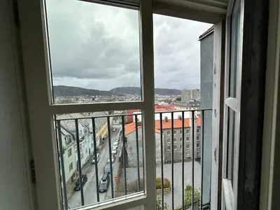a view of a city from a window at Sjarmerende bolig like ved togstasjonen in Bergen