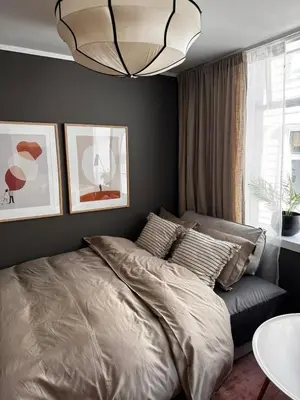 a bedroom with a bed and a chandelier at The DreamHouse - inner City Center - Old Town in Bergen