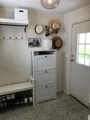 a room with a white dresser and a window at Villa Skoglund in Stranda