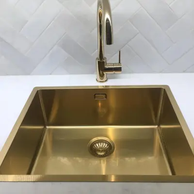 a stainless steel kitchen sink with a faucet at Villa Skoglund in Stranda