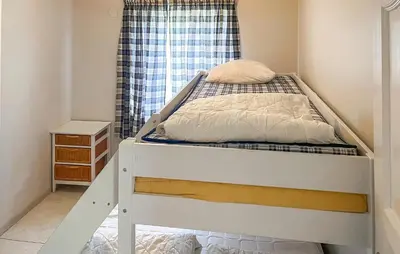 a bunk bed in a room with a window at Gorgeous Apartment In Eresfjord in Nauste
