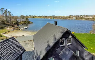 an aerial view of a house and a lake at Stunning Home In Sveio With Kitchen in Sveio