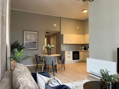 a living room with a couch and a table at Høyegaarden in Bergen