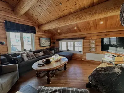 a living room with a couch and a table at Geilo centrum - cozy apartment - central location in Geilo