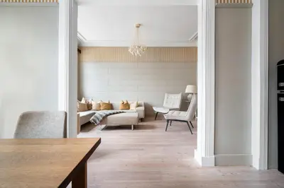a living room with a couch and a table at Experience the luxury lifestyle 100m from Bryggen! in Bergen