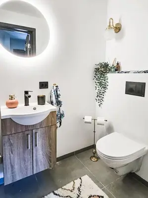 a bathroom with a toilet and a sink at Cozy Mountain Cottage with beautiful views & Sauna in Beitostøl