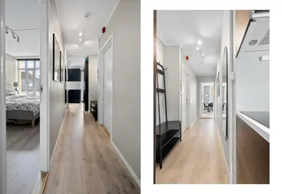 a room with white walls and a hallway with wood floors at Bergen Beds Apartments I Luxury 250m from Bryggen in Bergen