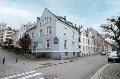 a large white building on the side of a street at Your Local Bergen Dream In The Heart Of The city in Bergen