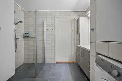 a bathroom with a shower and a glass door at Your Local Bergen Dream In The Heart Of The city in Bergen