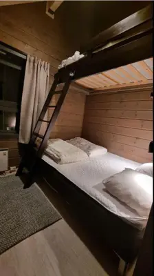 a bunk bed with a ladder in a room at Alpinvegen 22B, Trysil Alpin 22B in Trysil