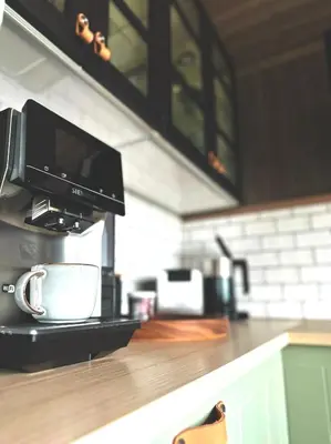 a microwave sitting on a counter in a kitchen at Snowcake Cottage in Sør-Fron