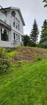 a house on top of a grassy hill at Holiday home in Steinkjer in Steinkjer