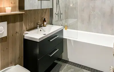 a bathroom with a sink and a shower and a toilet at Cozy Home In Ålen With Wifi in Ålen