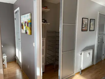 a hallway with a mirror and a closet at Enjoy Scenic Views From Your Balcony in Beitostøl