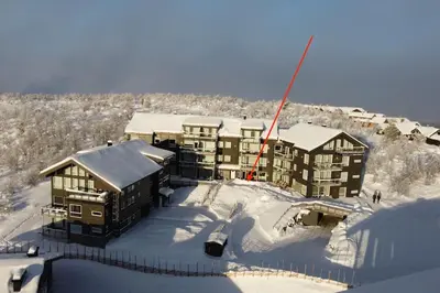 an aerial view of a building in the snow at Geilo Kikut - Ski-in Ski-out in Geilo