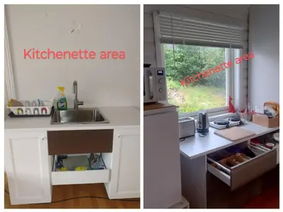 a kitchen counter with a sink and a kitchenette area at Sleep Over in Eiknes