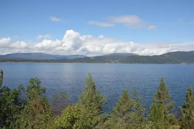 a large body of water with mountains in the background at Fjordhytte-40 im Vestland - Hordaland nahe Rosendal in Rosendal