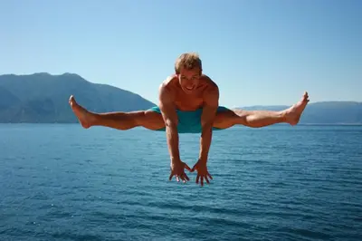 a man is jumping in the air over the water at Fjordhytte-23 direkt am Sognefjord, mit mietbaren Motorbooten 9,9-60 PS in Bjordal