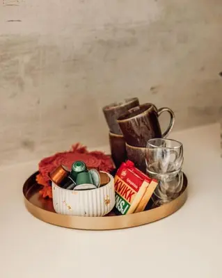 a table with a tray with different items on it at Fjord-view apartment in Ålesund