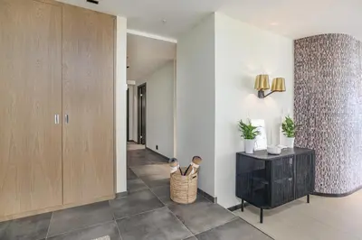 a hallway with a wooden cabinet and a hallway with a hallway at Nordnes Brygge in Bergen