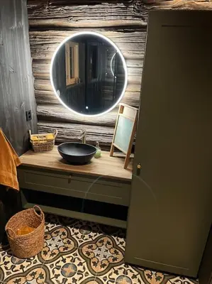 a bathroom with a mirror and a bowl on a counter at Rudland Gård - Unik gårdsovernatting i stabbur fra 1750 in Sør-Fron