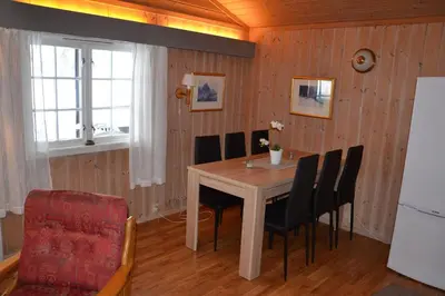 a dining room with a table and chairs at Lifjellhytte 10 by Norgesbooking - cabin at Golsfjellet in Gol