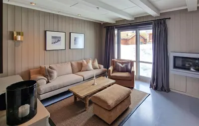 a living room with a couch and a table at 2 Bedroom Stunning Home In Geilo in Geilo