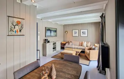 a living room with a table and a couch at 2 Bedroom Stunning Home In Geilo in Geilo