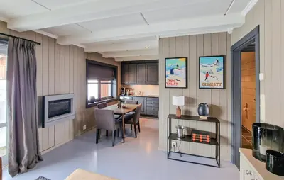 a kitchen and dining room with a table and chairs at 2 Bedroom Stunning Home In Geilo in Geilo