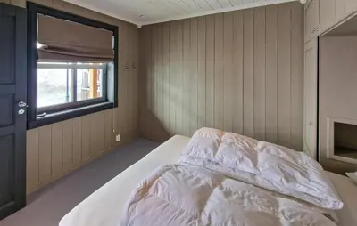 a bedroom with a bed and a window at 2 Bedroom Stunning Home In Geilo in Geilo