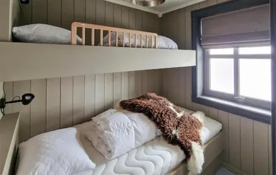a childs room with a bunk bed and pillows at 2 Bedroom Stunning Home In Geilo in Geilo