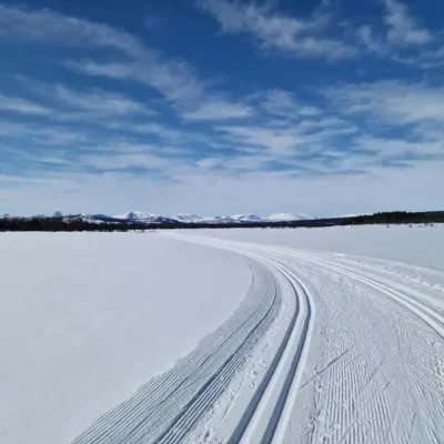 a snow covered road with tracks in the snow at Family-friendly apartment for rent at Golsfjellet in Golsfjellet