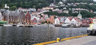a city with a harbor with boats in the water at Dreggsalmenning 20 in Bergen