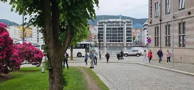 a group of people walking down a city street at Dreggsalmenning 20 in Bergen