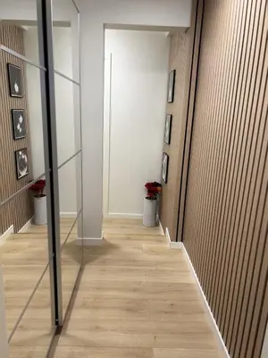 a hallway with a glass door in a building at Apartment Lagunen with Terrace, Grill and Free Parking in Bergen