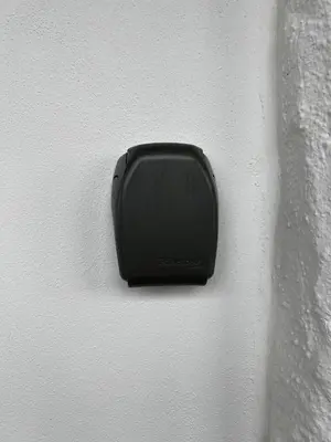 a black object on the side of a white wall at Apartment Lagunen with Terrace, Grill and Free Parking in Bergen