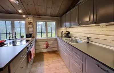 a kitchen with white cabinets and a sink at Awesome Home In Aurdal With Sauna in Aurdal