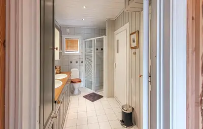 a bathroom with a sink and a toilet at Feriehus-Bjørkedal in Folkestad