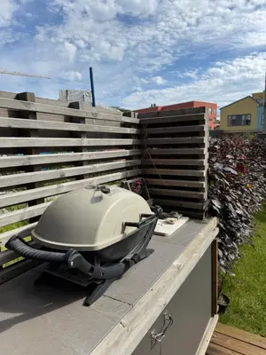 a grill sitting on top of a roof at Modern 4 bedroom townhouse with garden and indoor car park in Trondheim