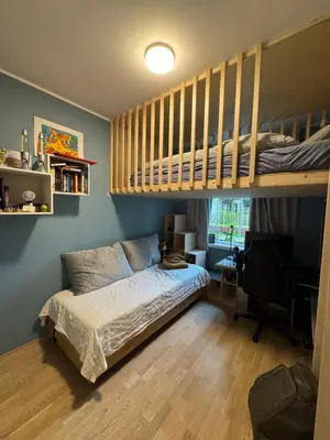 a bedroom with a bunk bed and a loft bed at Modern 4 bedroom townhouse with garden and indoor car park in Trondheim