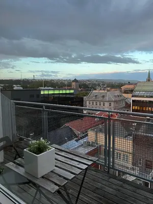 a balcony with a view of a city at Penthouse in Trondheim City Centre in Trondheim