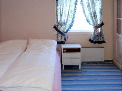 a bedroom with a bed and a window at Holiday Home Nystølen by Interhome in Håvik