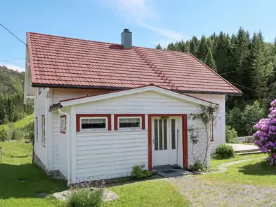 a small white shed with a red roof at Holiday Home Nystølen by Interhome in Håvik