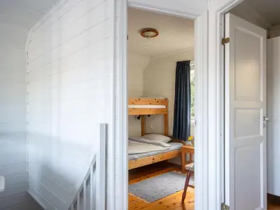 a small bedroom with a bunk bed in it at Holiday Home Nesjaholmen by Interhome in Kalavåg