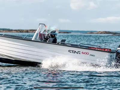 a white speed boat on the water at Holiday Home Pale by Interhome in Bømlo