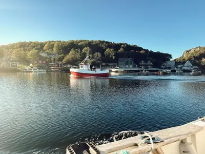 a boat is docked in a body of water at Holiday Home Pale by Interhome in Bømlo