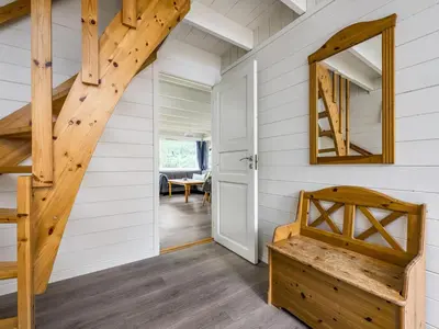a staircase in a tiny house with a mirror at Holiday Home Balder by Interhome in Arnefjord